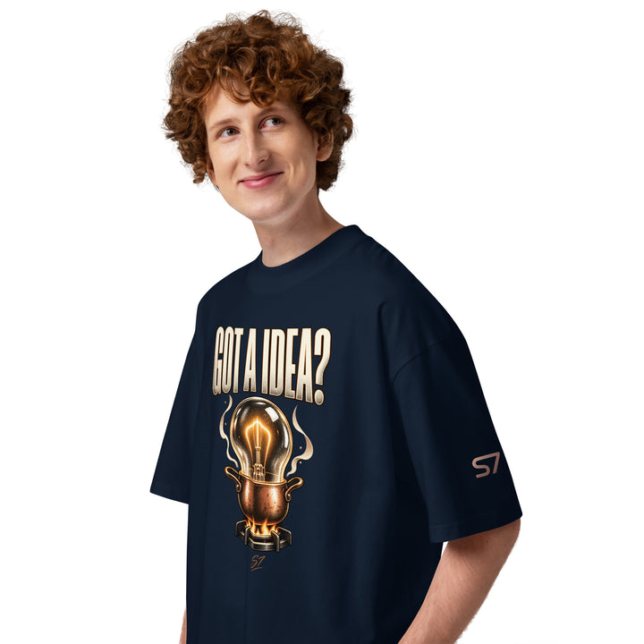 S7 “Got A Idea? Let It Cook” Graphic T-Shirt featuring a glowing bulb in a pot design, model smiling.