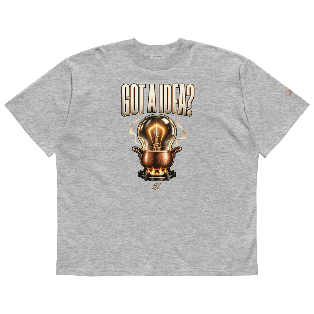 S7 “Got A Idea? Let It Cook” Graphic T-Shirt featuring a glowing bulb in a copper pot on a gray background.