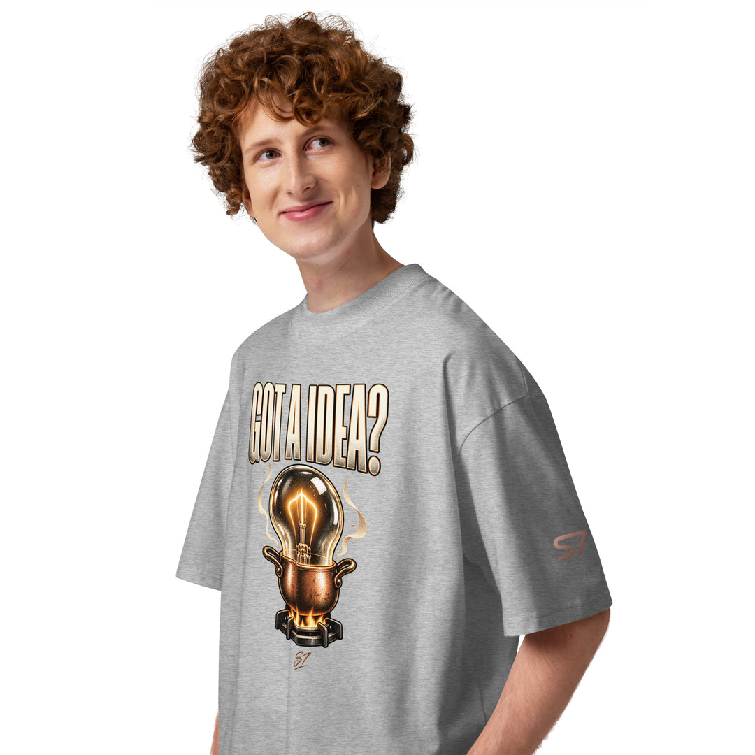 S7 “Got A Idea? Let It Cook” Graphic T-Shirt featuring a glowing bulb above a copper pot on a model.