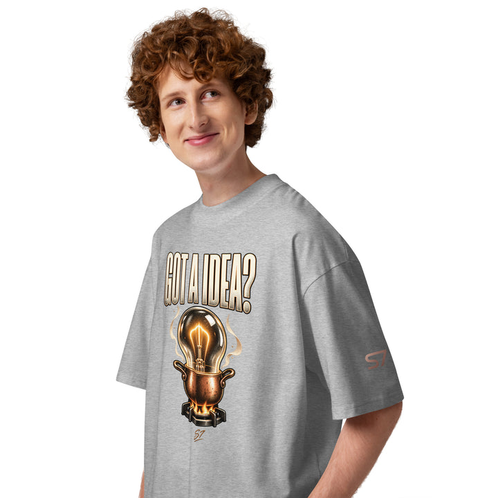 S7 “Got A Idea? Let It Cook” Graphic T-Shirt featuring a glowing bulb above a copper pot on a model.