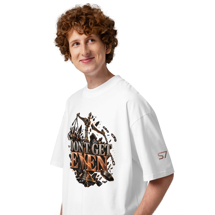 Model wearing the DON’T GET EVEN—GET BETTER Transformation T-Shirt | S7, showcasing bold graphics on a white shirt.