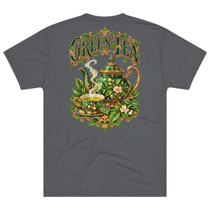 S7 Green Tea shirt featuring an ornate emerald teapot, matching teacup, botanical leaves, and gold-tone Green Tea lettering.