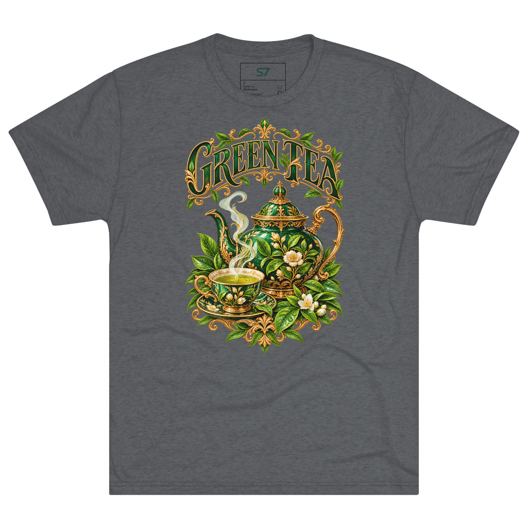 S7 Green Tea shirt featuring an ornate emerald teapot, matching teacup, botanical leaves, and gold-tone Green Tea lettering.