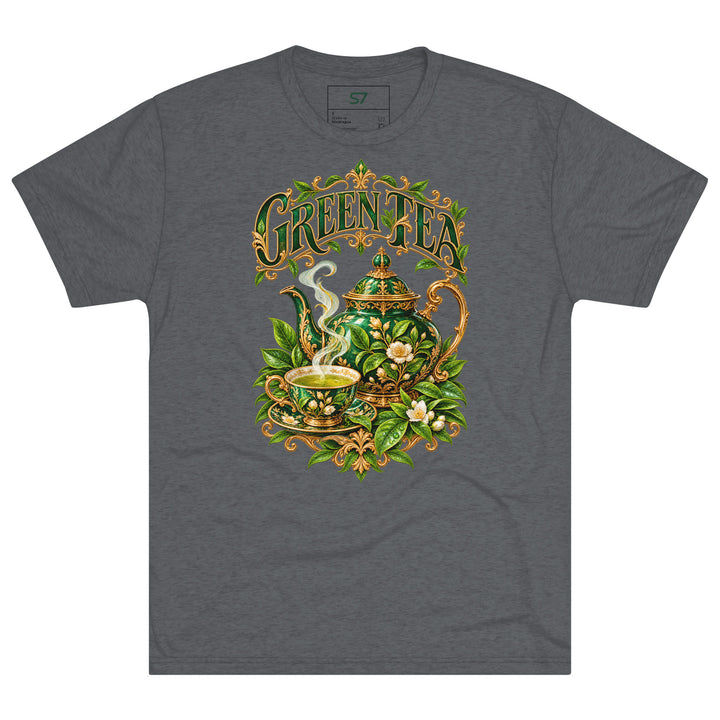 S7 Green Tea shirt featuring an ornate emerald teapot, matching teacup, botanical leaves, and gold-tone Green Tea lettering.