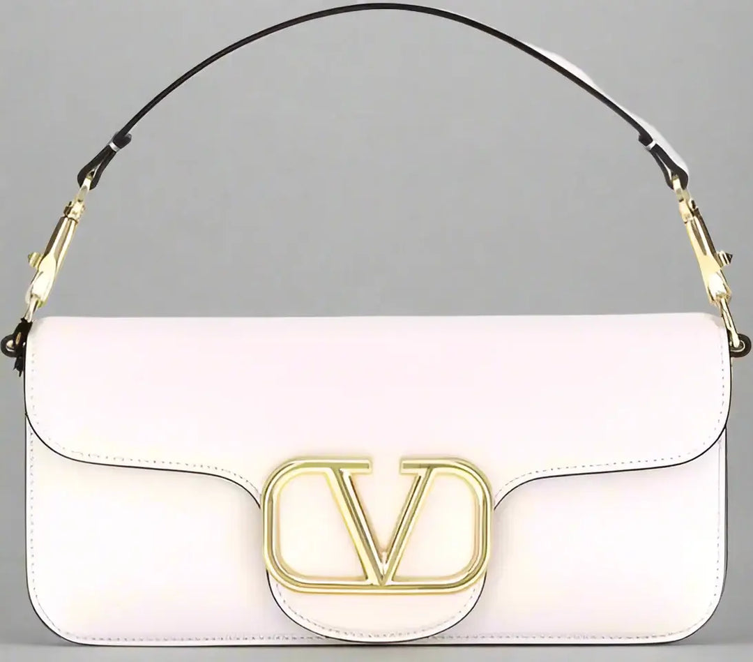 White handbag with gold logo on a white background