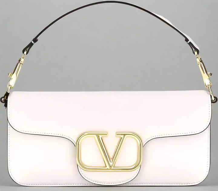 White handbag with gold logo on a white background