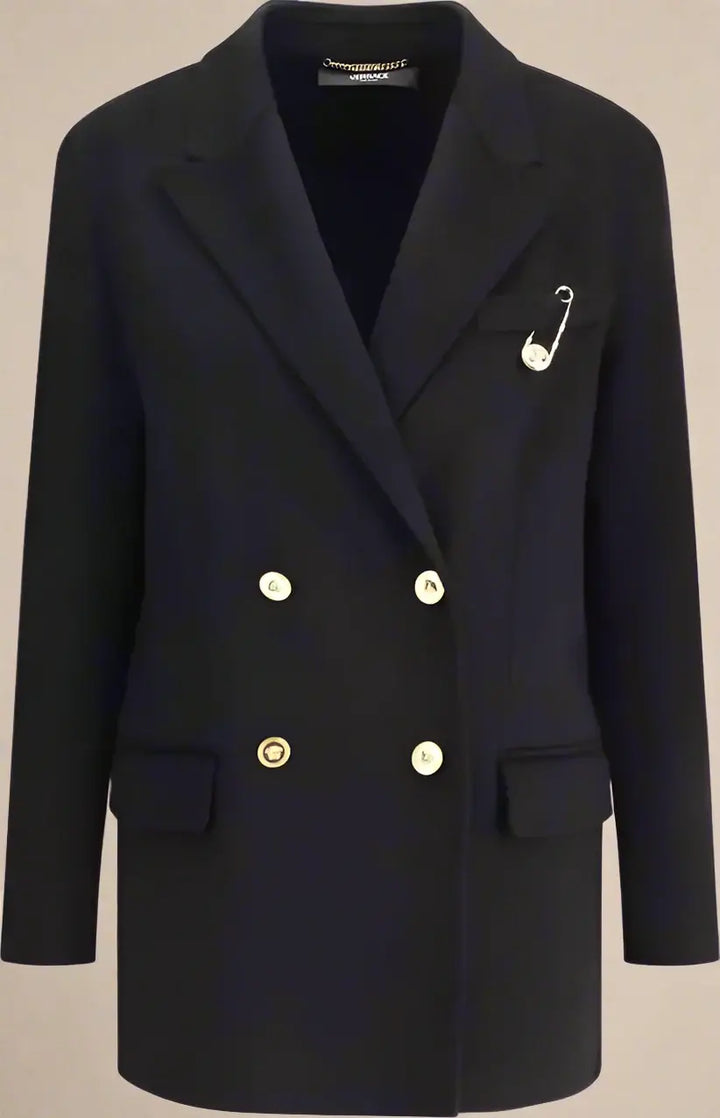Black blazer with gold buttons and a brooch on a white background