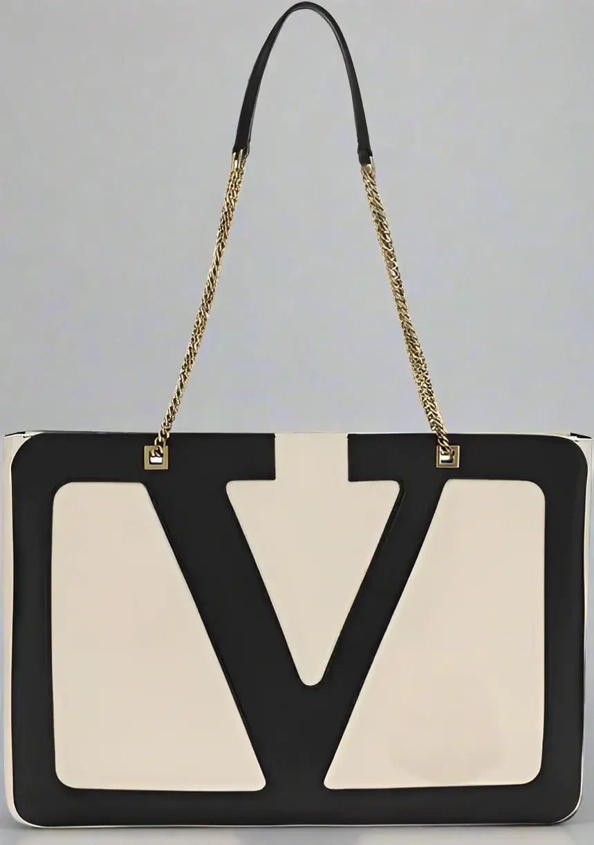 Black and beige handbag with a prominent 'V' logo on a white background