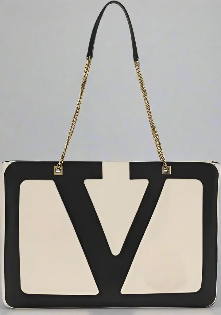 Black and beige handbag with a prominent 'V' logo on a white background