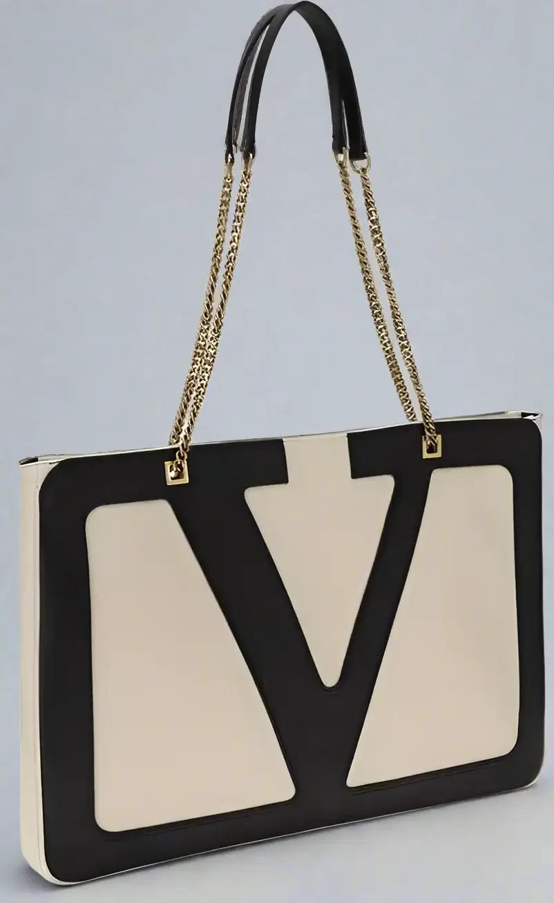 Designer handbag with a prominent logo on a white background