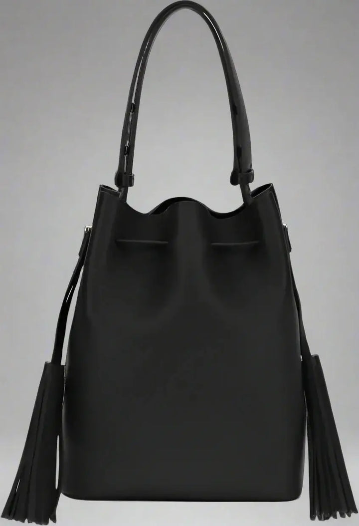 Black handbag with tassels on a white background