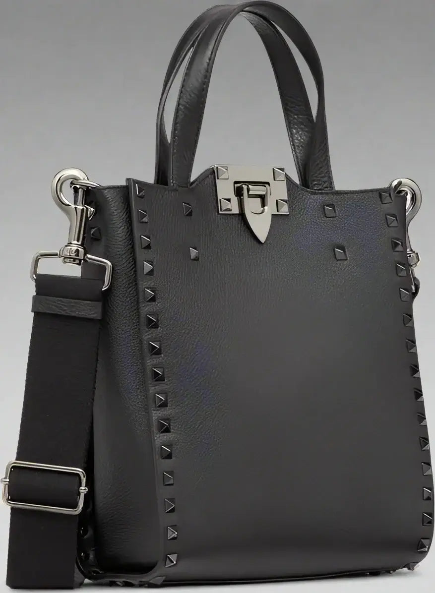 Black handbag with silver studs and hardware on a white background