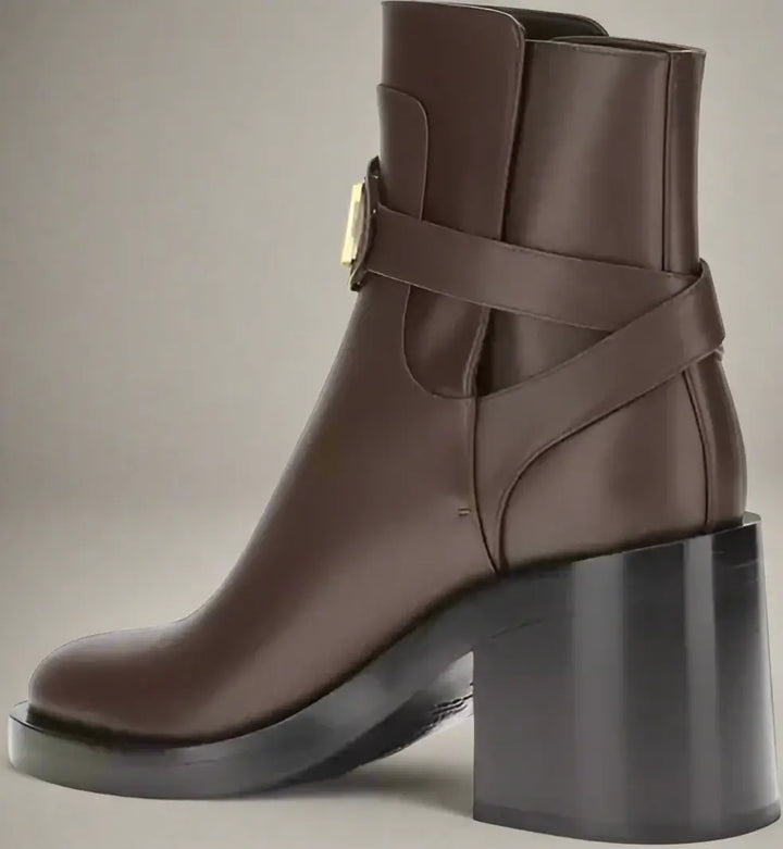 Brown leather ankle boot with a block heel on a white background