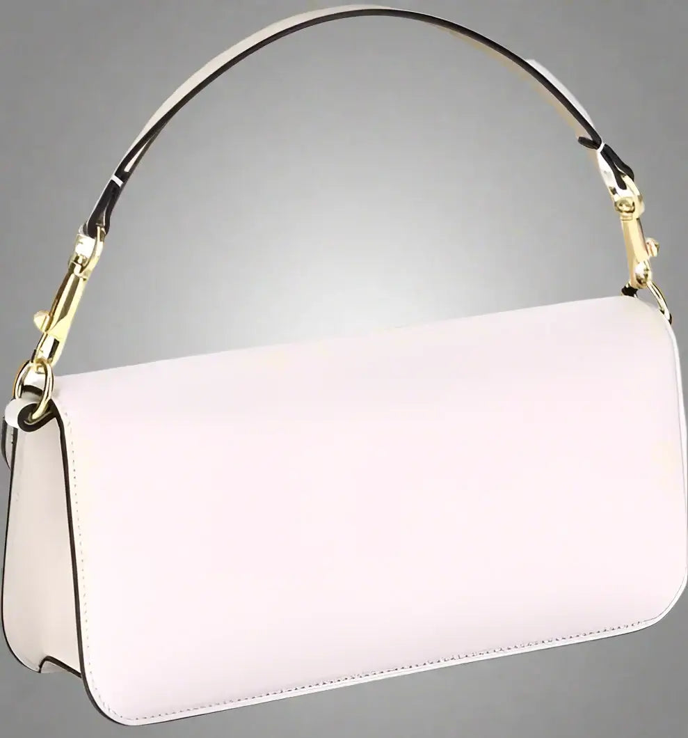 White handbag with a gold handle on a white background