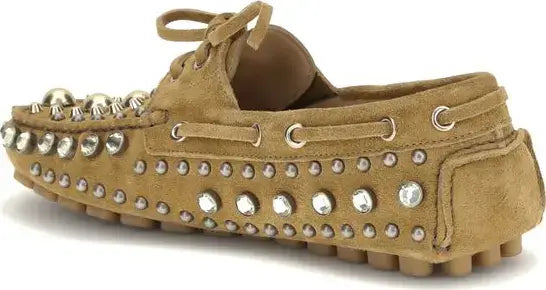 Tan suede loafer with silver studs on a white background