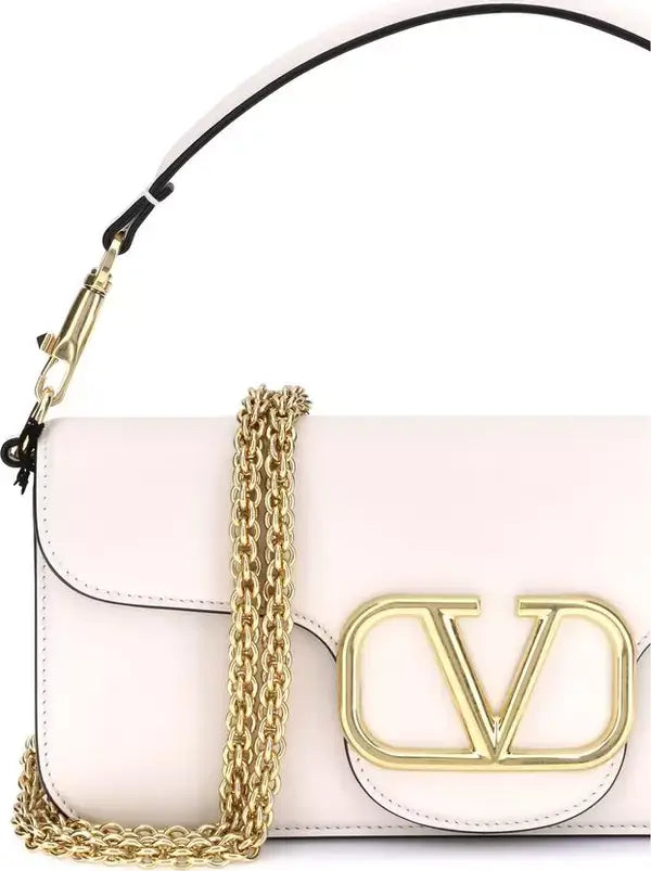 White handbag with gold chain and logo on a white background