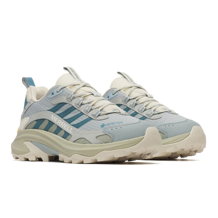 Light blue and beige sneaker with striped pattern on a white background