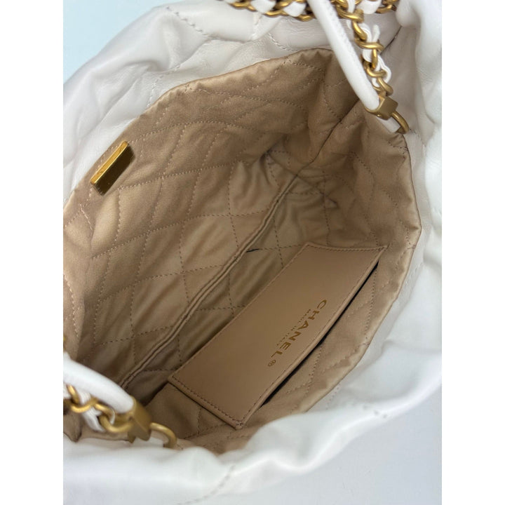 Close-up of a quilted handbag interior with visible brand name.