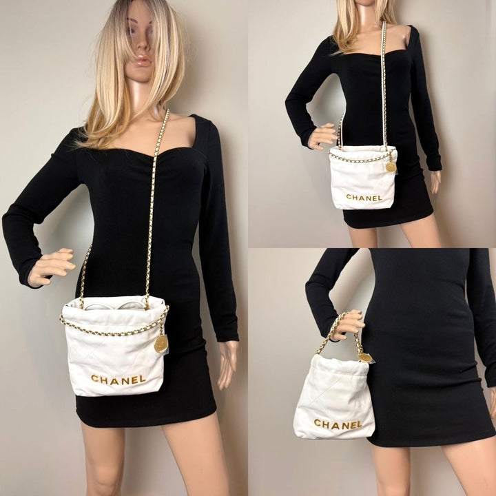 Two mannequins wearing black outfits with white Chanel handbags against a neutral background