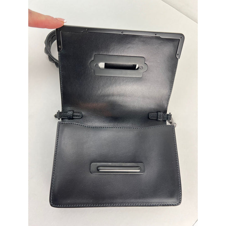 Black leather clutch bag with a handle on a white background