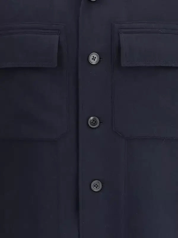Close-up of a navy blue shirt with button details