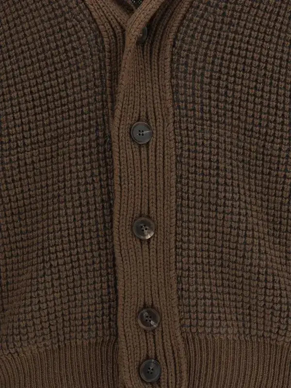 Close-up of a brown textured cardigan with buttons.
